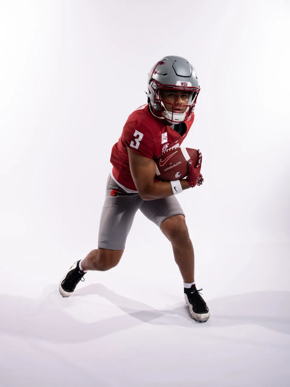 Washington State wide receiver running with the football